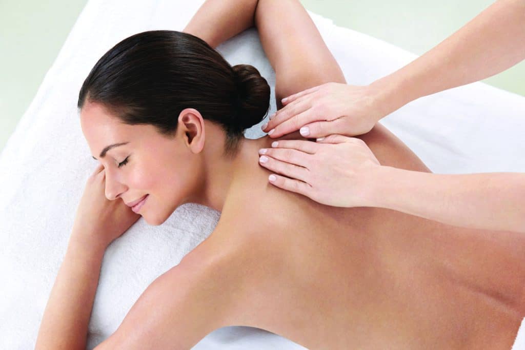Women lying down receiving a massage