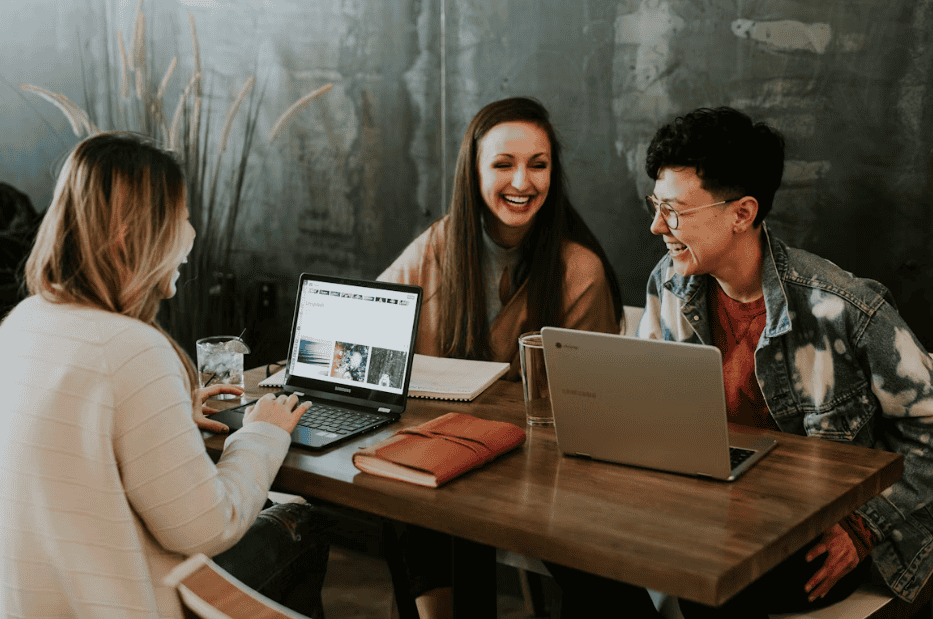 employees sat laughing together at work