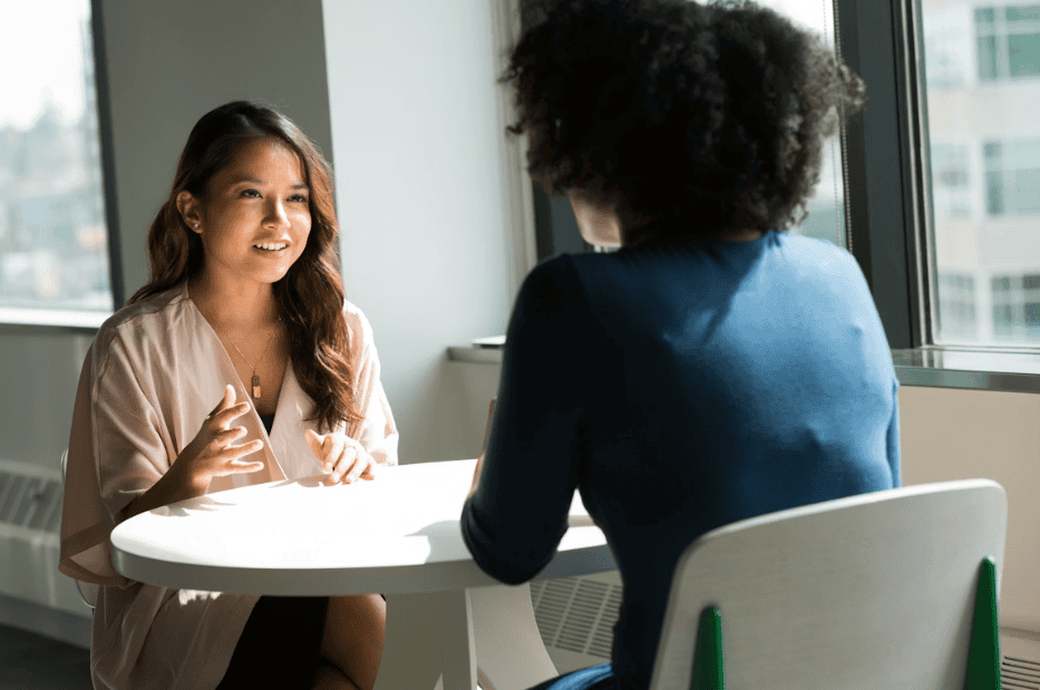 two ladies at work having a conversation