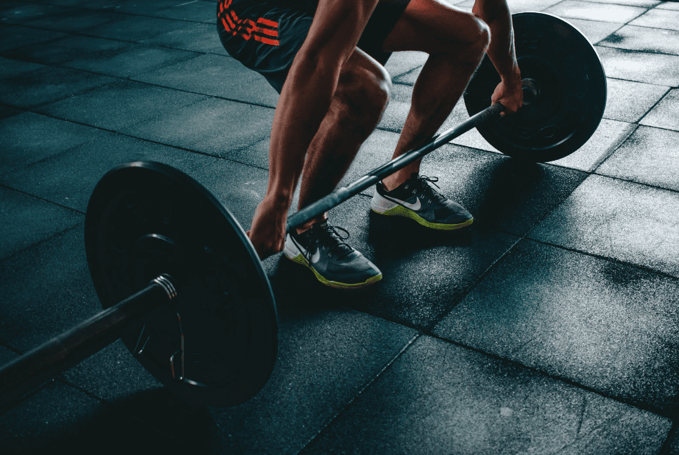 man deadlifting in gym