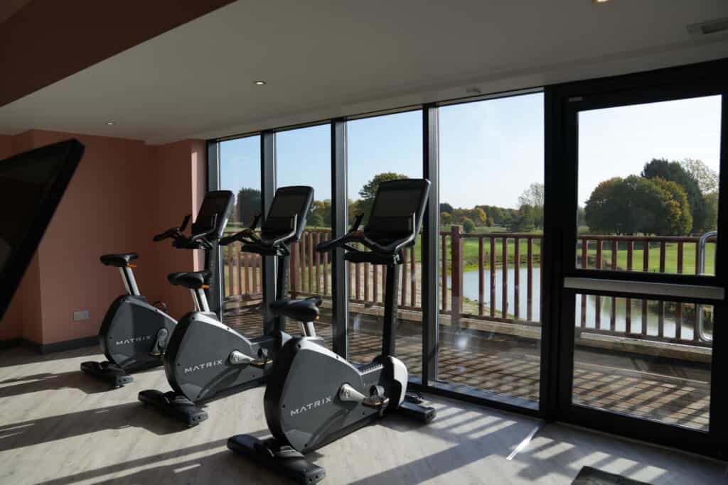 Cycling machines looking out to lake